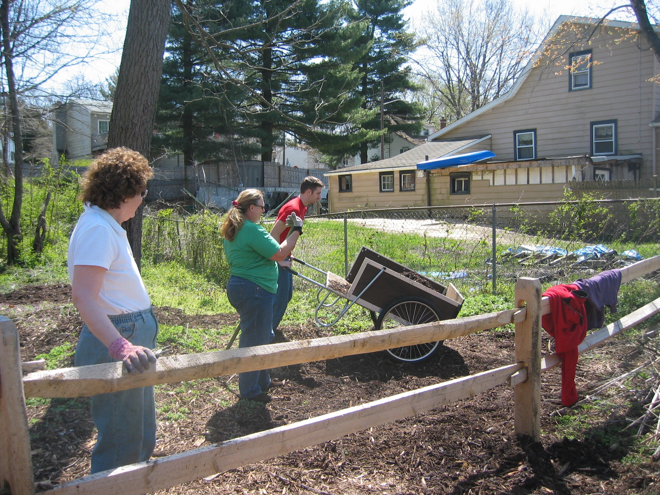 Volunteers with wheelbarrow at Old Pine Farm